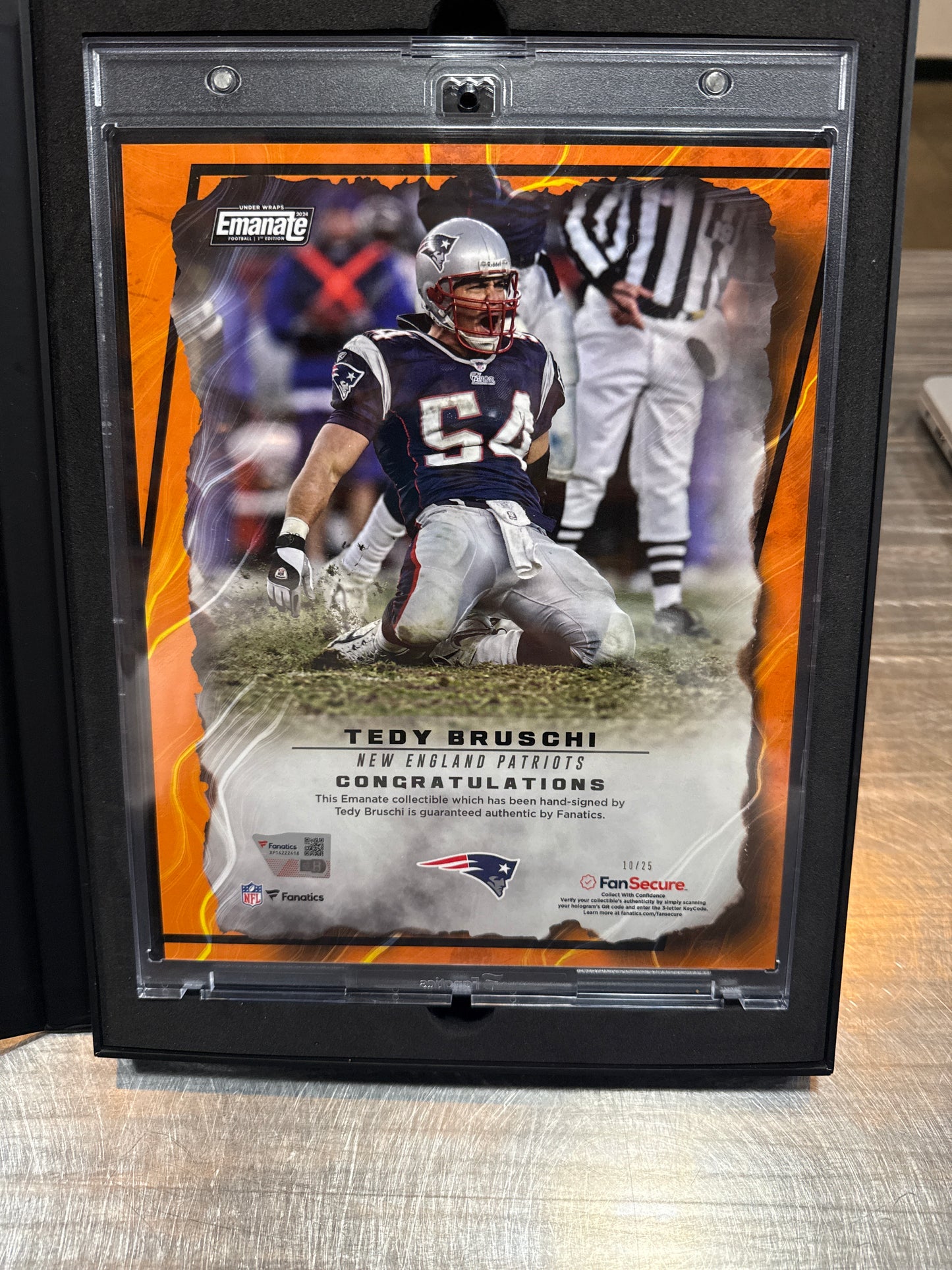 2024 Emanate Under Wraps Football 1st Edition Tedy Bruschi Orange #10/25