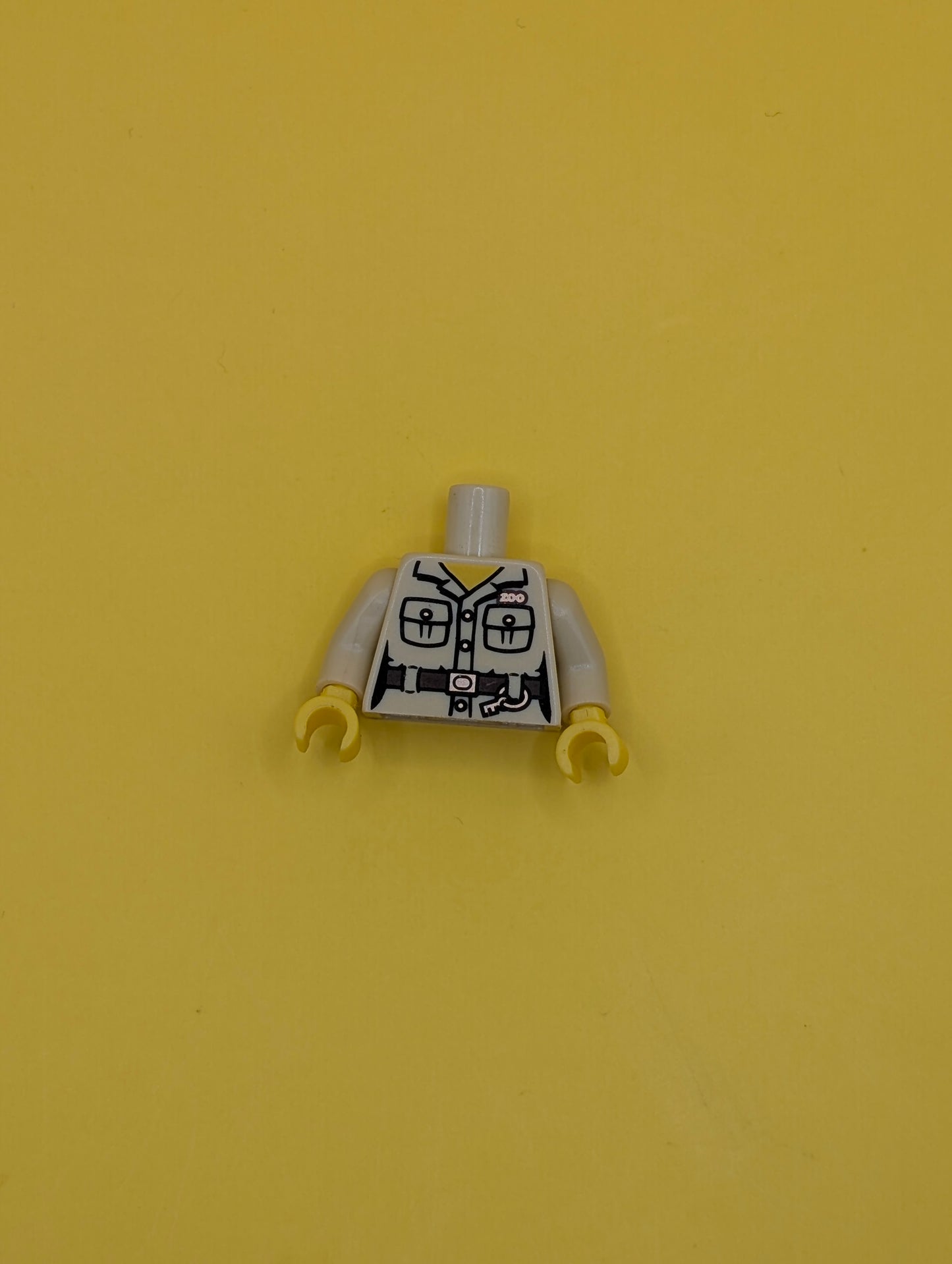 973pb0935c01 Torso Safari Shirt with Pockets, Belt, Key Ring and 'ZOO' Pattern / Tan Arms / Yellow Hands Lego Part