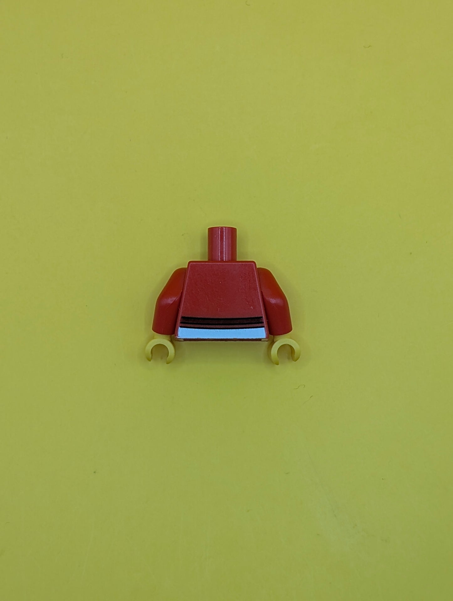 973pb0580c01 Torso Sweater Cropped with Dark Red Bow and Trim over White Shirt with Bright Light Orange Stars, Silver Heart Pendant Necklace, Yellow Neck Pattern / Red Arms / Yellow Hands Lego Part