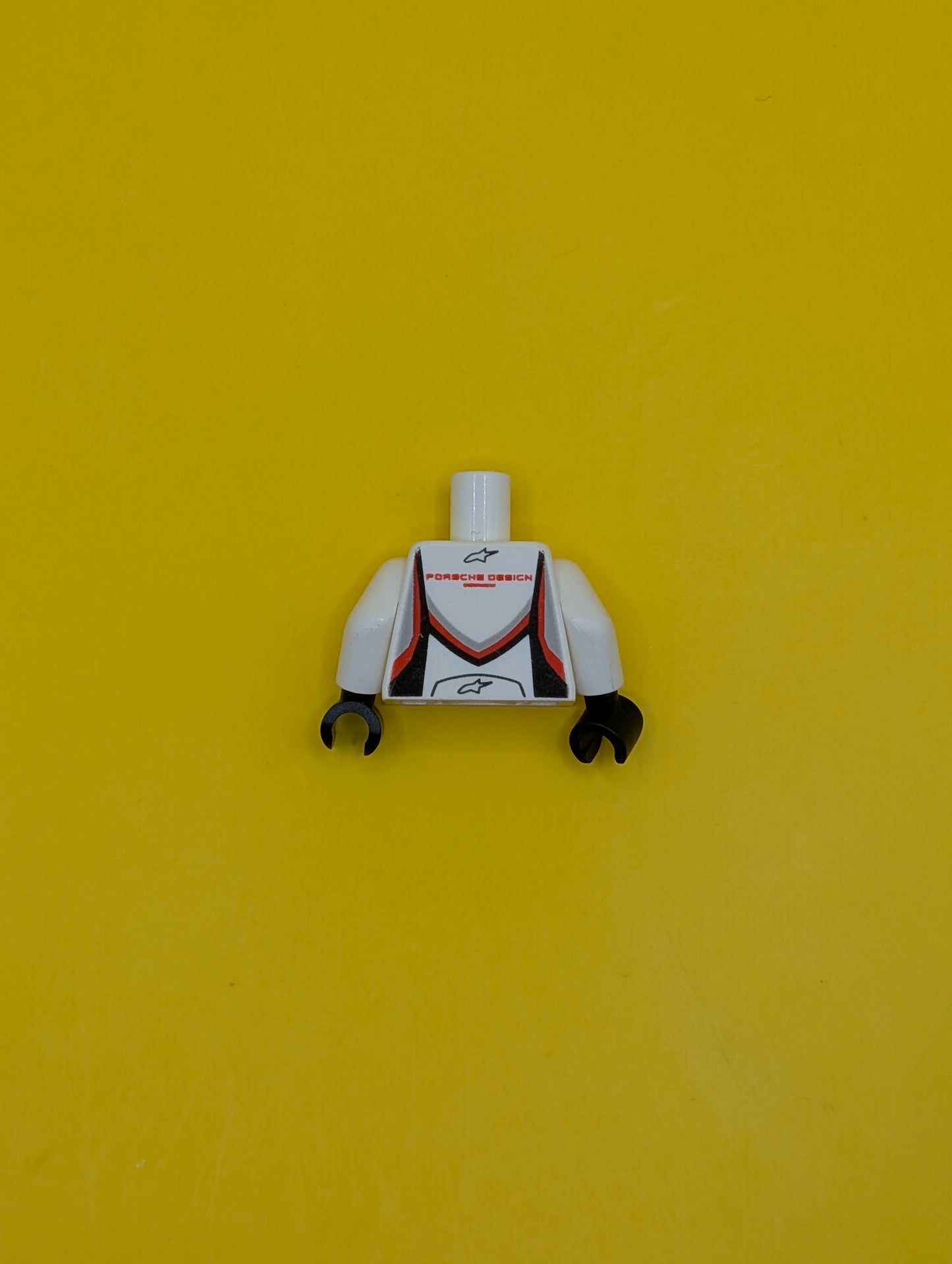 973pb3322c01 Torso Speed Champions with Mobil 1 and WEC Logo on Front, Porsche Design Logo on Back Pattern / White Arms / Black Hands Lego Part