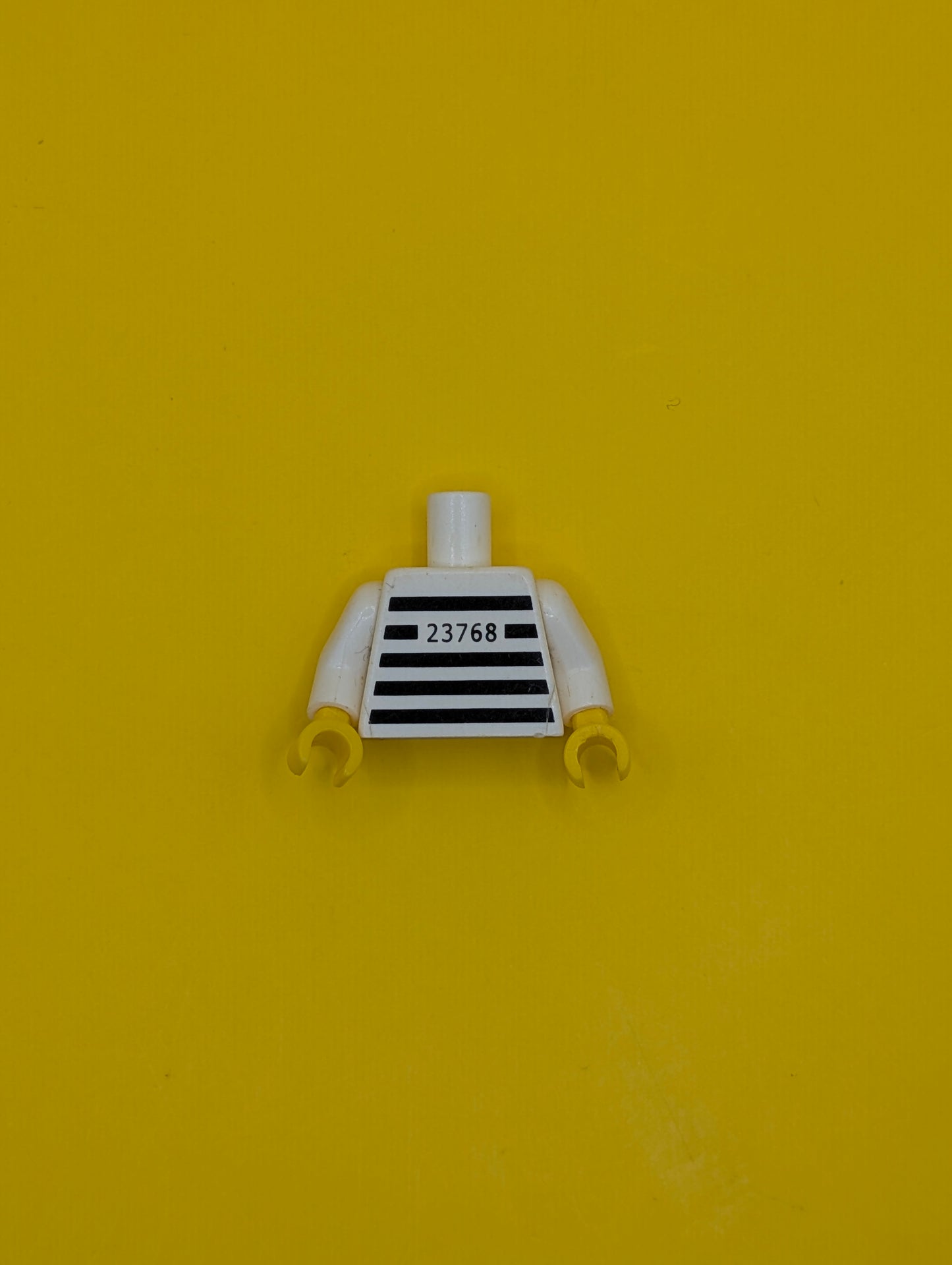 973pb4515c01 Torso Prison Shirt with Black Stripes and '23768' Thin Font Pattern (Reissue) / White Arms / Yellow Hands Lego Part