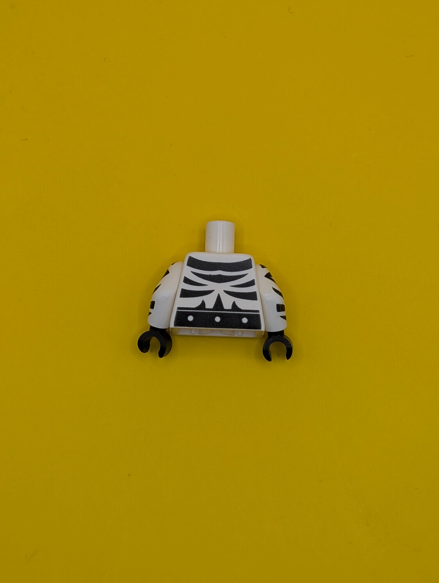 973pb2628c01 Torso Super Hero with Black Zebra Stripes and Belt on Front and Back Pattern / White Arms with Black Zebra Stripes Pattern / Black Hands Lego Part