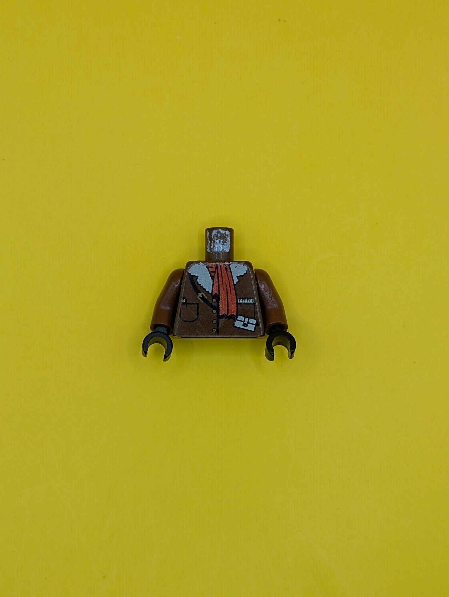 Torso Jacket with Buttons, Pockets, and White Fur Collar, Black Strap with Pouch and Yellow Buckle, Red Scarf, Pen, Notepad Pattern / Brown Arms / Black Hands 973px179c01 Lego