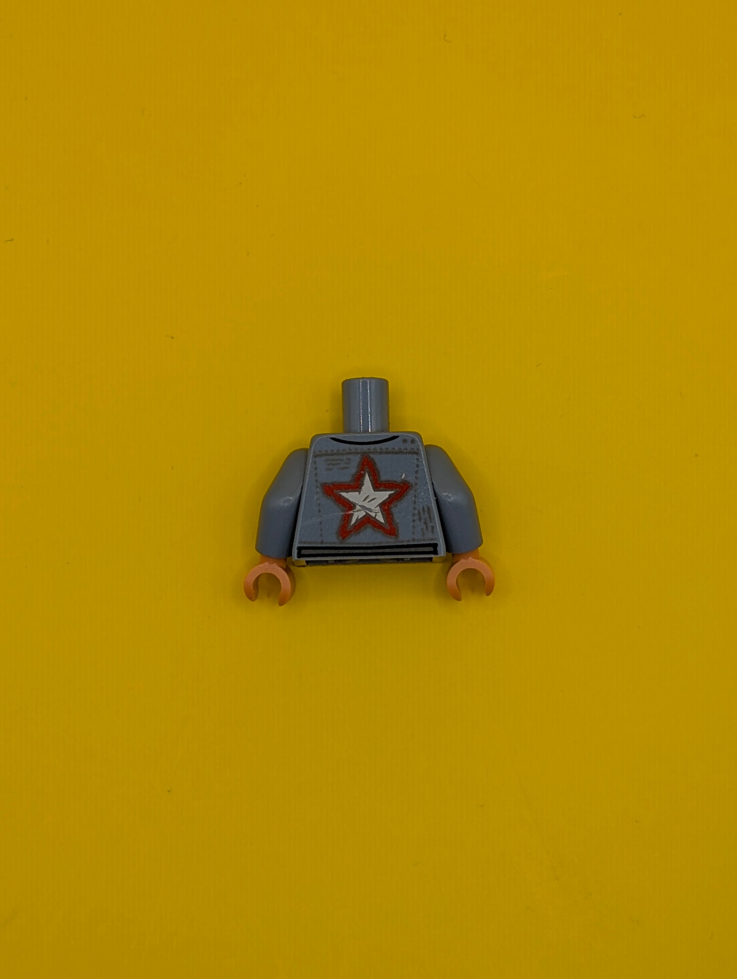 973pb4655c01 Torso Jacket with Pockets, Red Trim and Star over Light Bluish Gray Shirt, Belt with Silver Buckles Pattern / Sand Blue Arms / Nougat Hands Lego Part