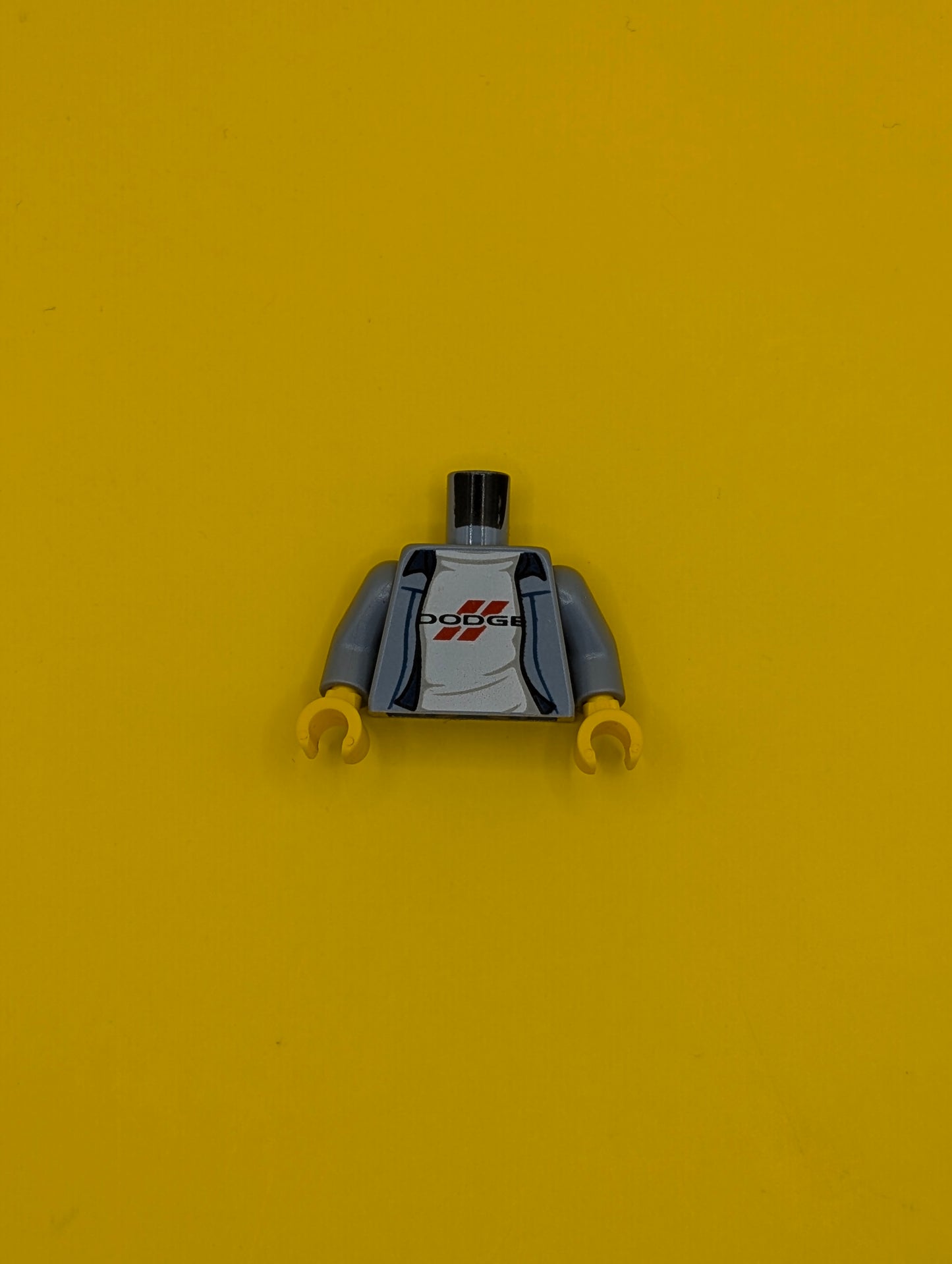 973pb3426c01 Torso Jacket with Dodge Logo on White Rumpled Shirt Pattern / Sand Blue Arms / Yellow Hands Lego Part