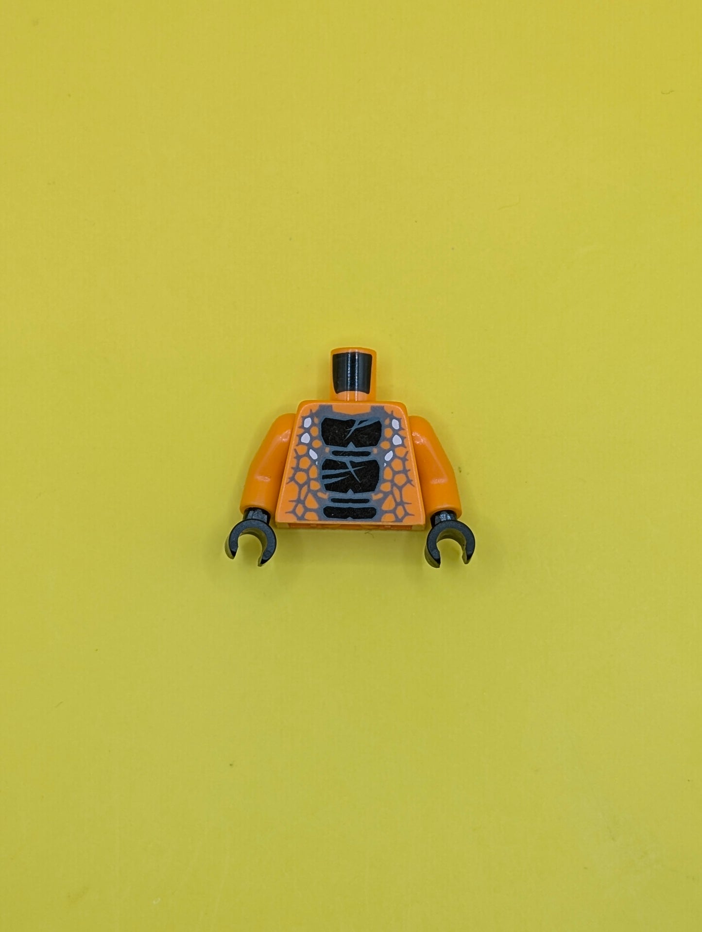 973pb1196c01 Torso Ninjago Snake with Black Scales Pattern (Snike) / Orange Arms / Black Hands Lego Part