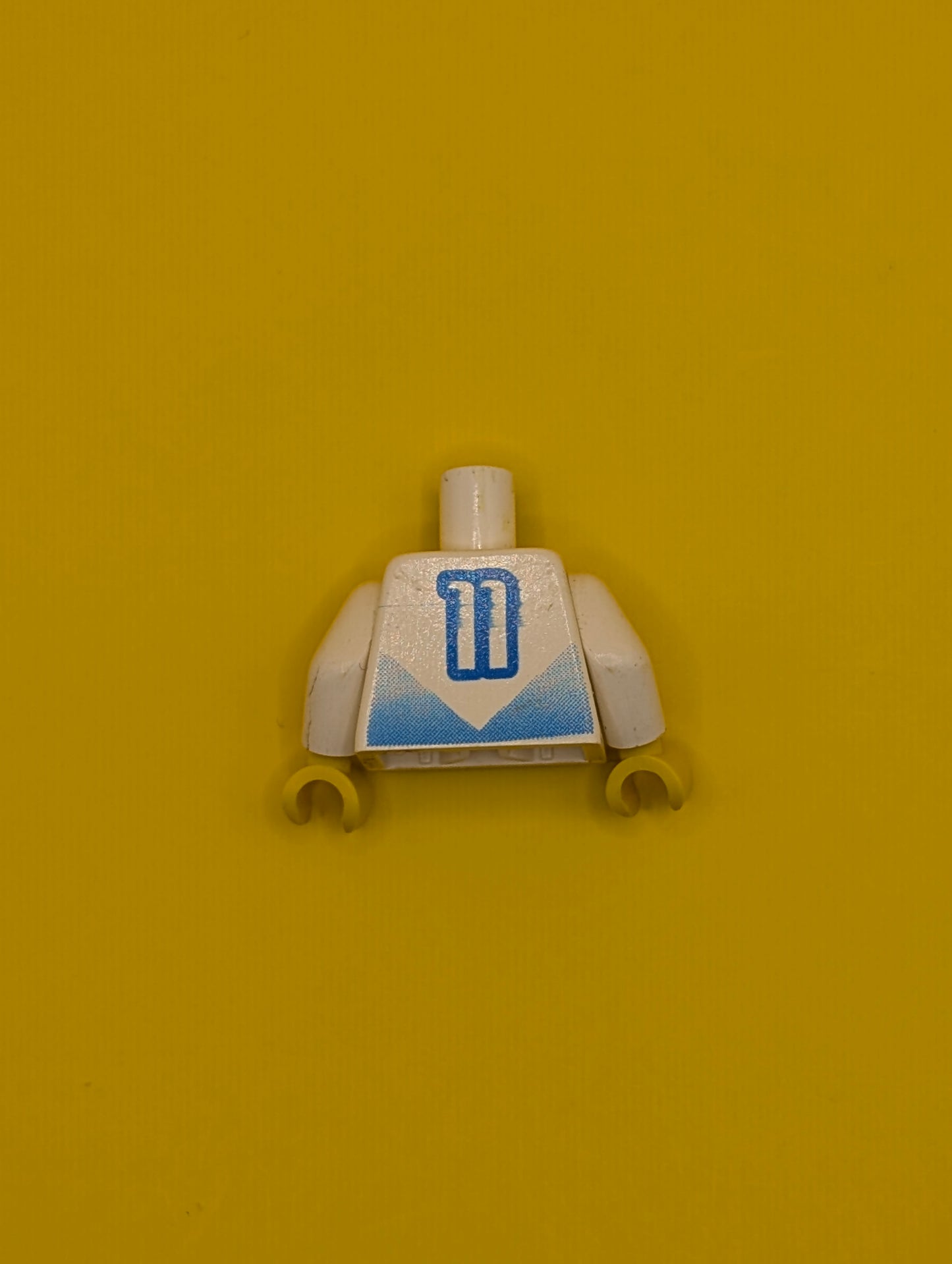 Torso Soccer Jersey Shirt with Blue Chevron and Number 11, Yellow Neck Pattern / White Arms / Yellow Hands 973pb0176c01 Lego