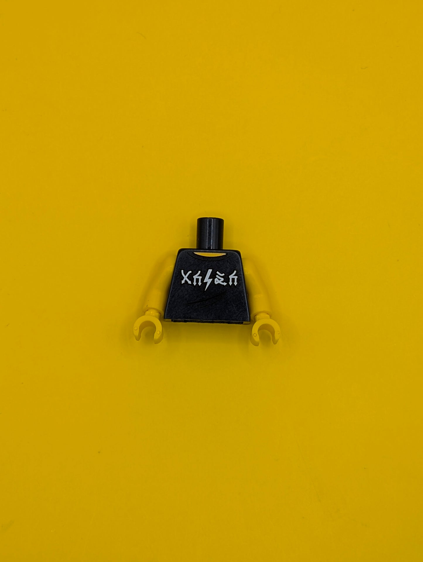 973pb2790c01 Torso Sleeveless Top with White Arrow and Lightning Symbols and 'WORLD TOUR' 'SOLD OUT' '1985' Pattern / Yellow Arms / Yellow Hands Lego Part