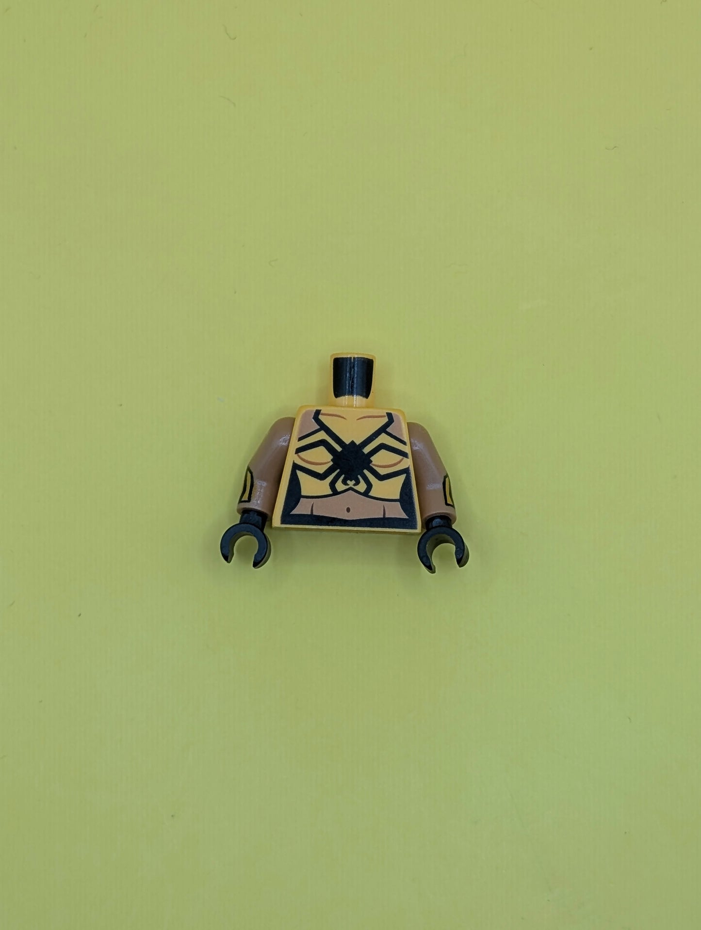 973pb2629c01 Torso Female Top with Black Spider and Medium Nougat Waist Pattern / Medium Nougat Arms with Bright Light Orange Cuffs Pattern / Black Hands Lego Part