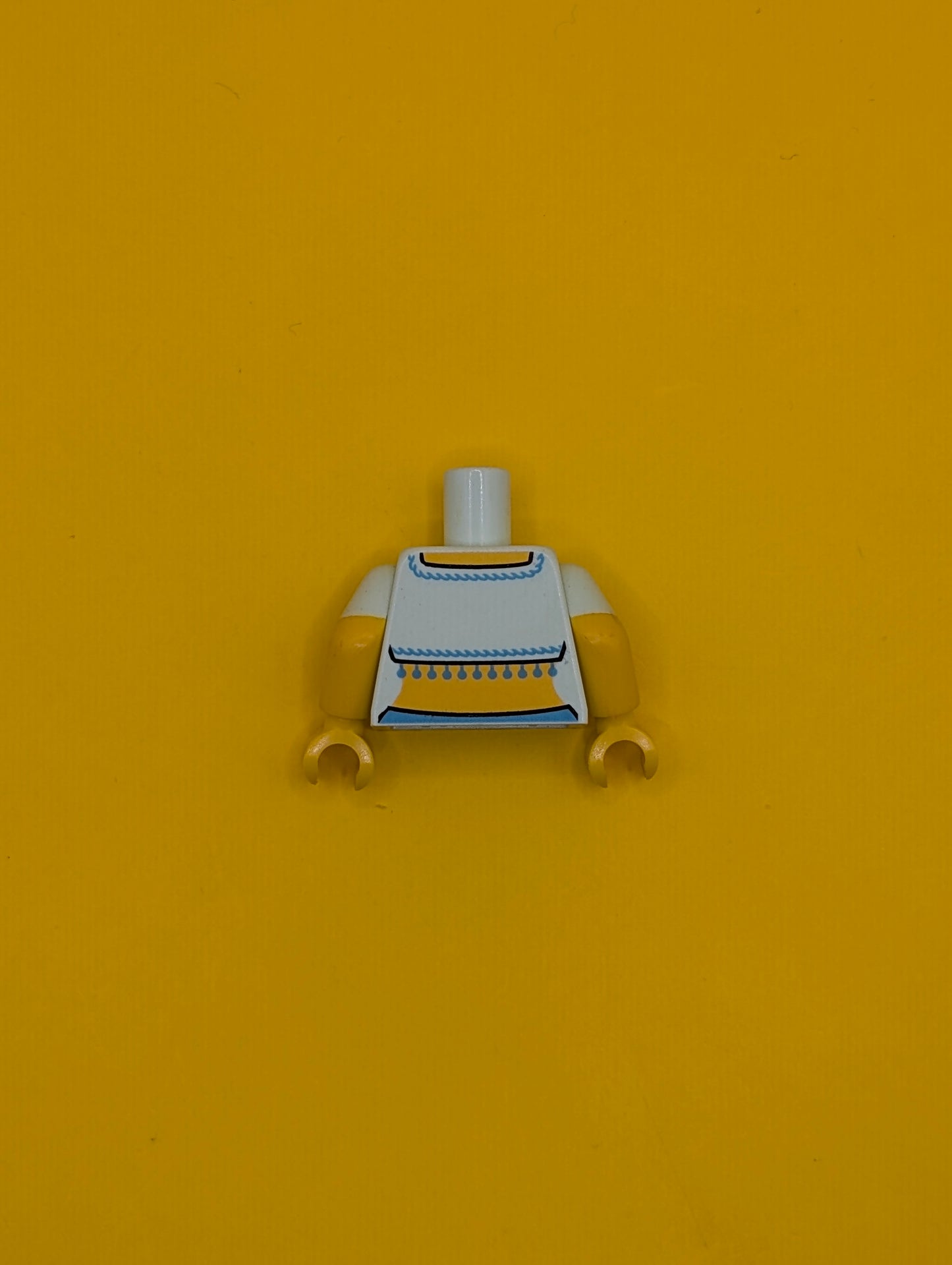 973pb1770c01 Torso Fringed Crop Top Pattern (Genie) / Yellow Arms with Molded Light Aqua Short Sleeves Pattern / Yellow Hands Lego Part
