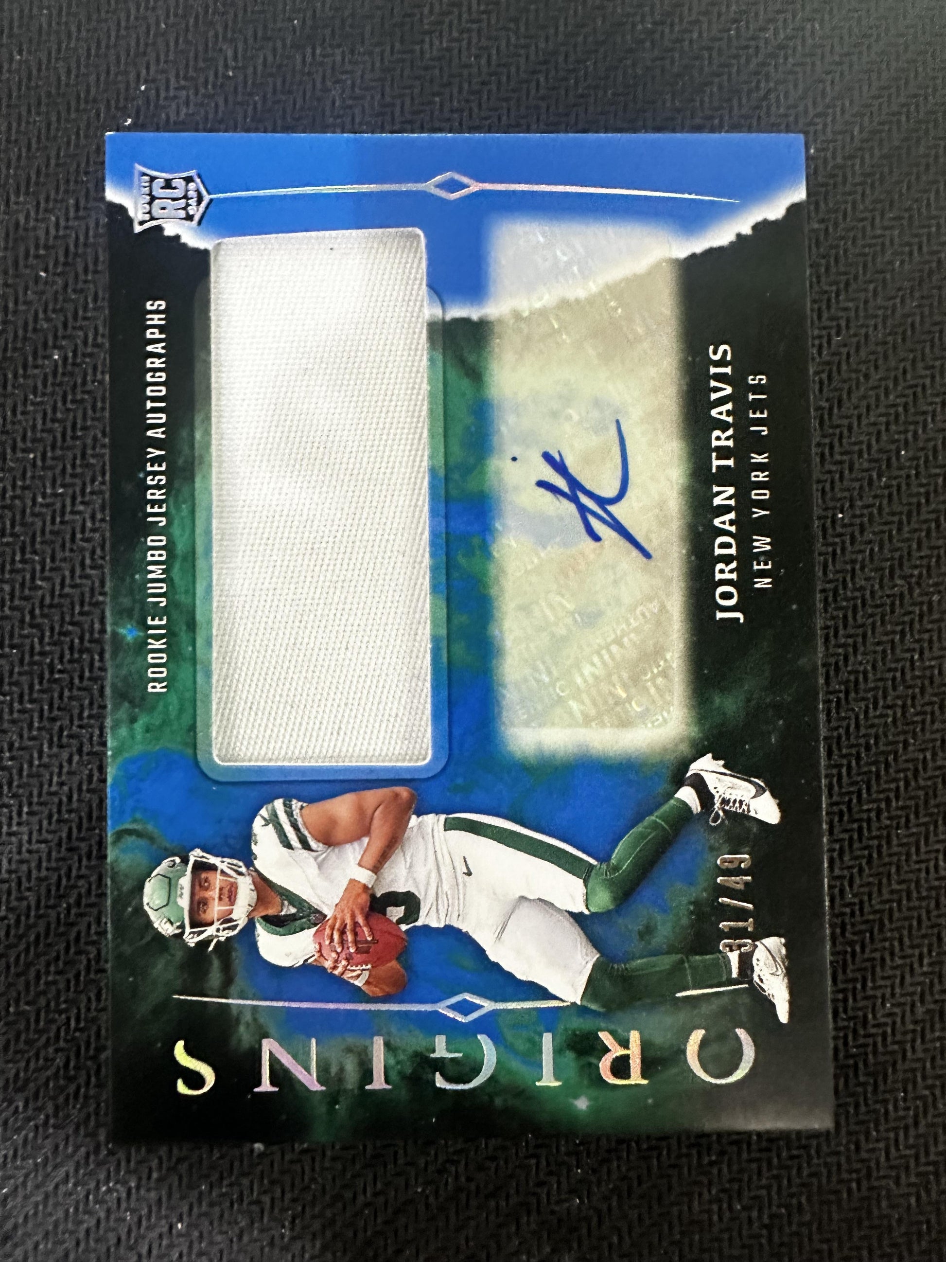 #RJA-JTR Jordan Travis 2024 Panini Origins /49 Jets Jumbo Jersey Auto Blue