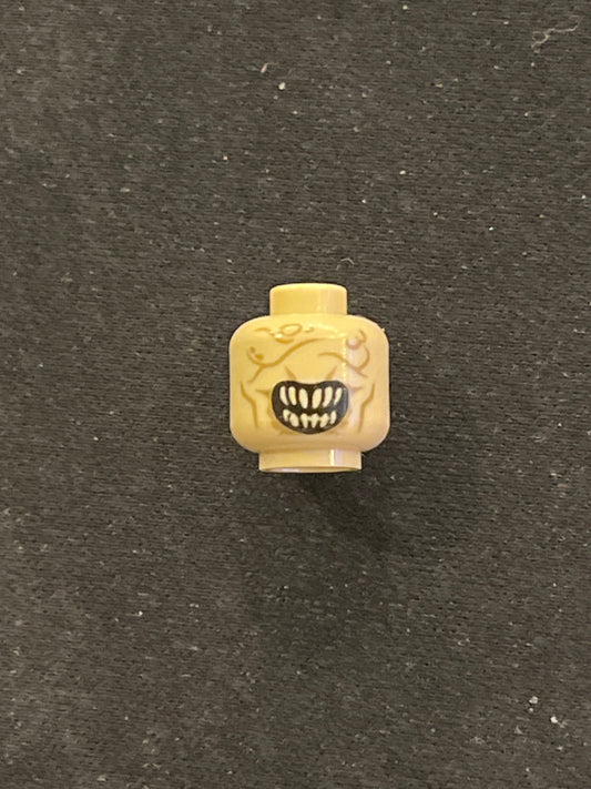 Minifigure, Head Alien with Wide Open Mouth with Pointed Bright Light Yellow Teeth, Dark Tan Wrinkles and Scars, Light Bluish Gray Thin Hair on Back Pattern 3626pb0948 Lego