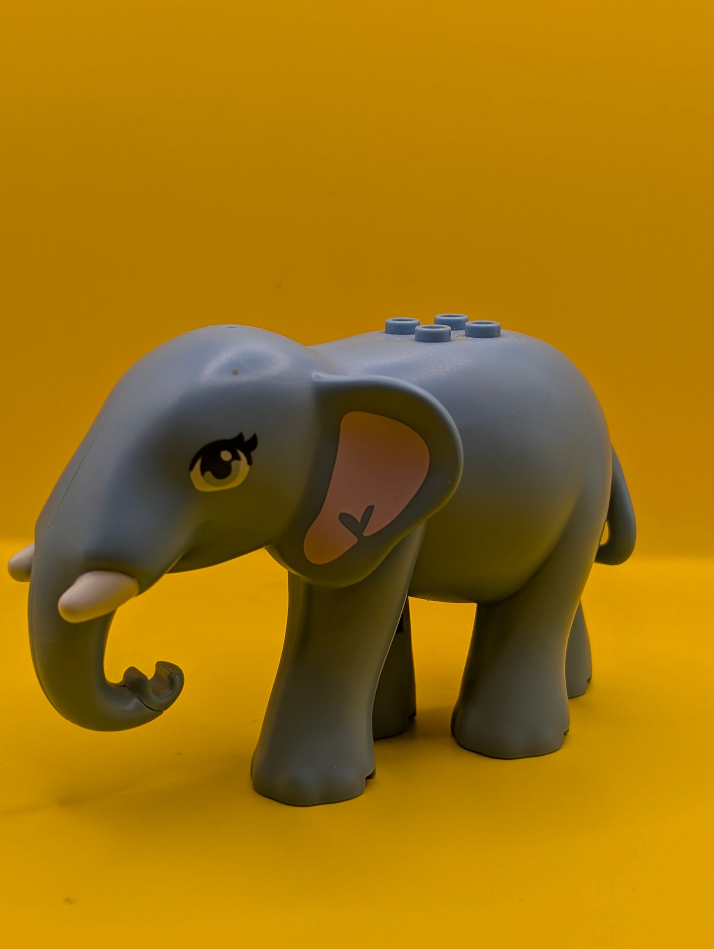 Elephant 67150c01pb01 Friends Style with Bright Light Blue Eyes with Eyelashes, Bright Pink Inner Ears and White Tusks Pattern Lego Minifigure