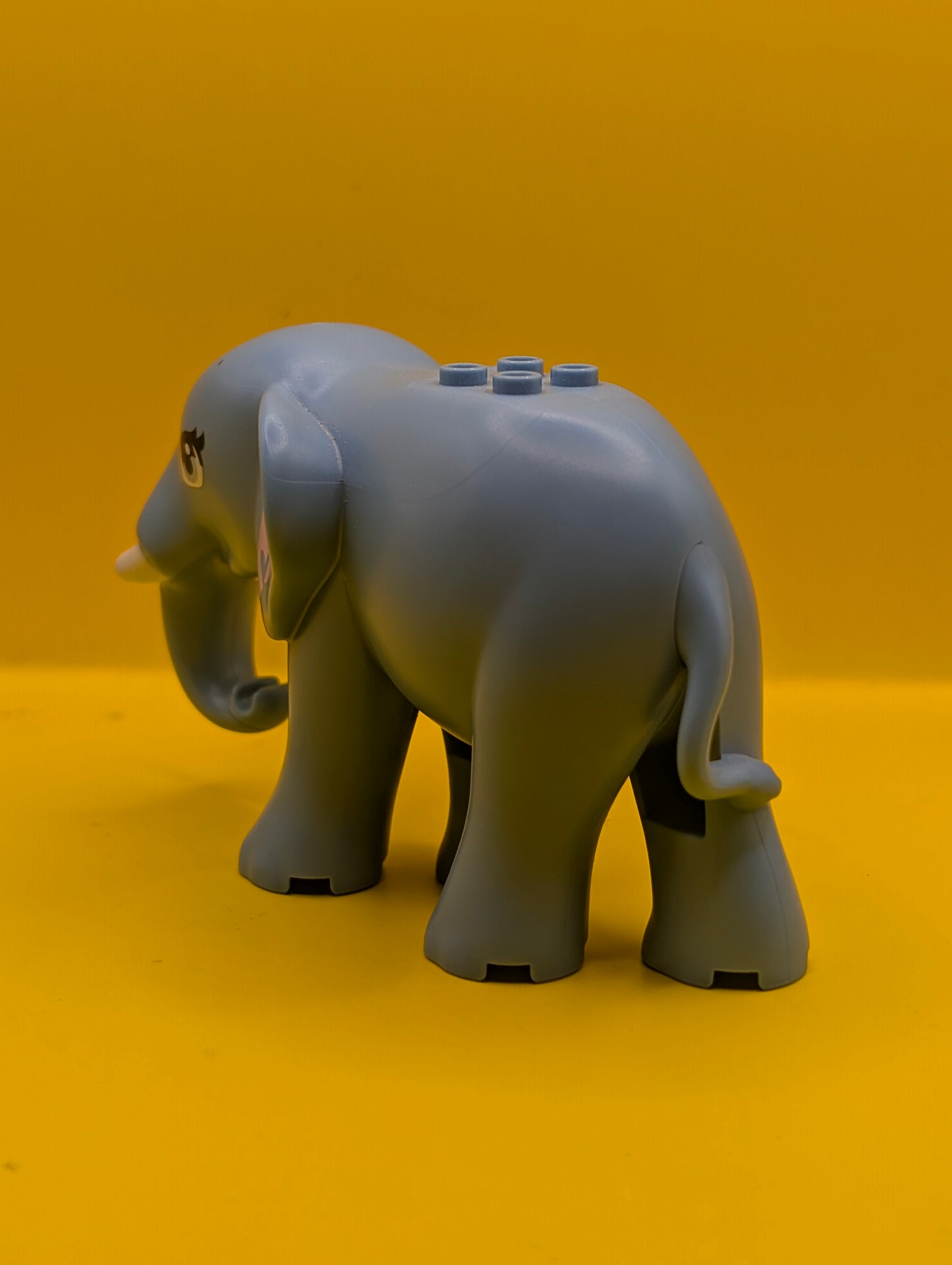 Elephant 67150c01pb01 Friends Style with Bright Light Blue Eyes with Eyelashes, Bright Pink Inner Ears and White Tusks Pattern Lego Minifigure