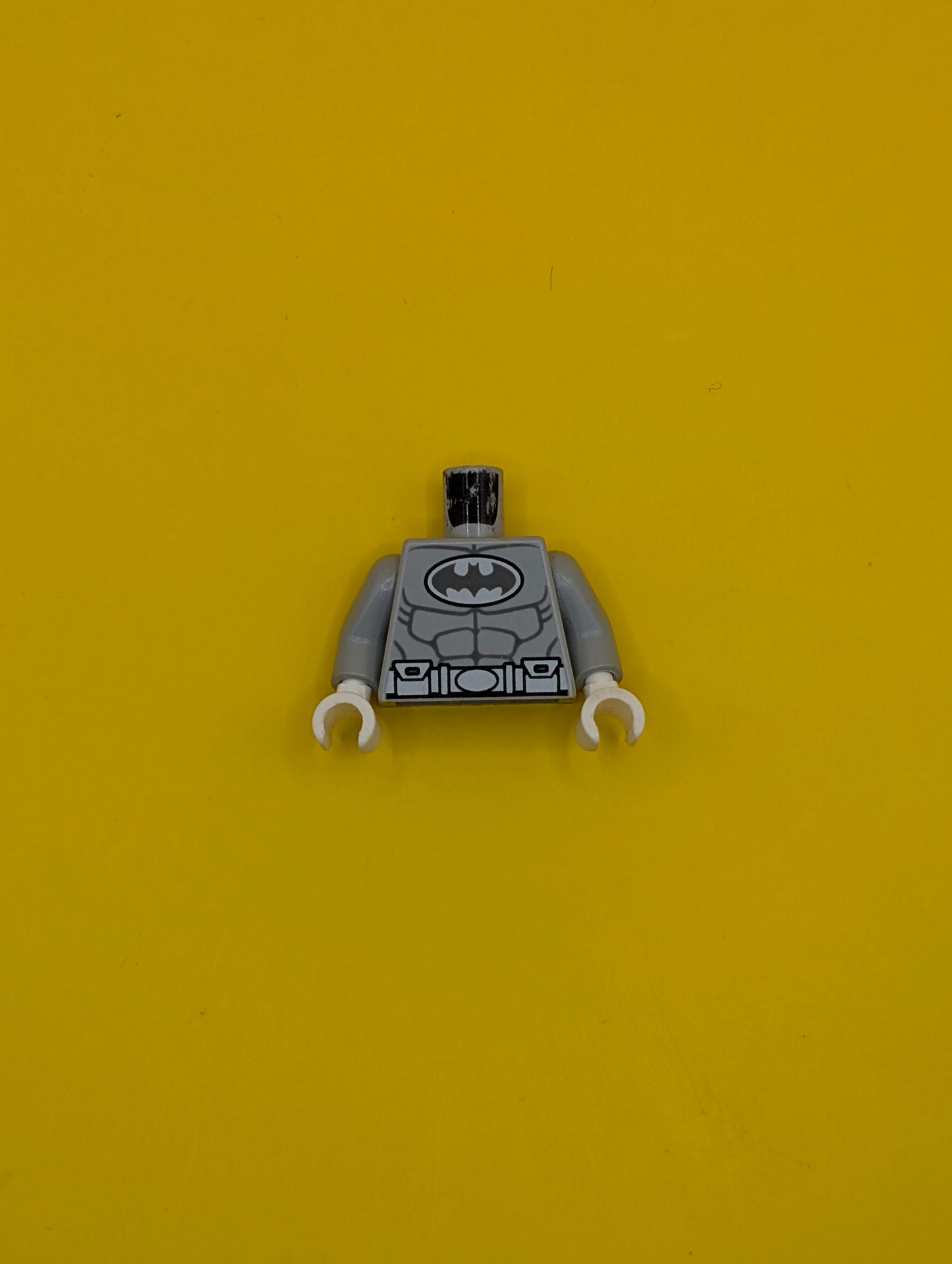 973pb1294c01 Torso Batman Logo in White Oval with Muscles and White Belt on Front and Back Pattern / Light Bluish Gray Arms / White Hands Lego Part