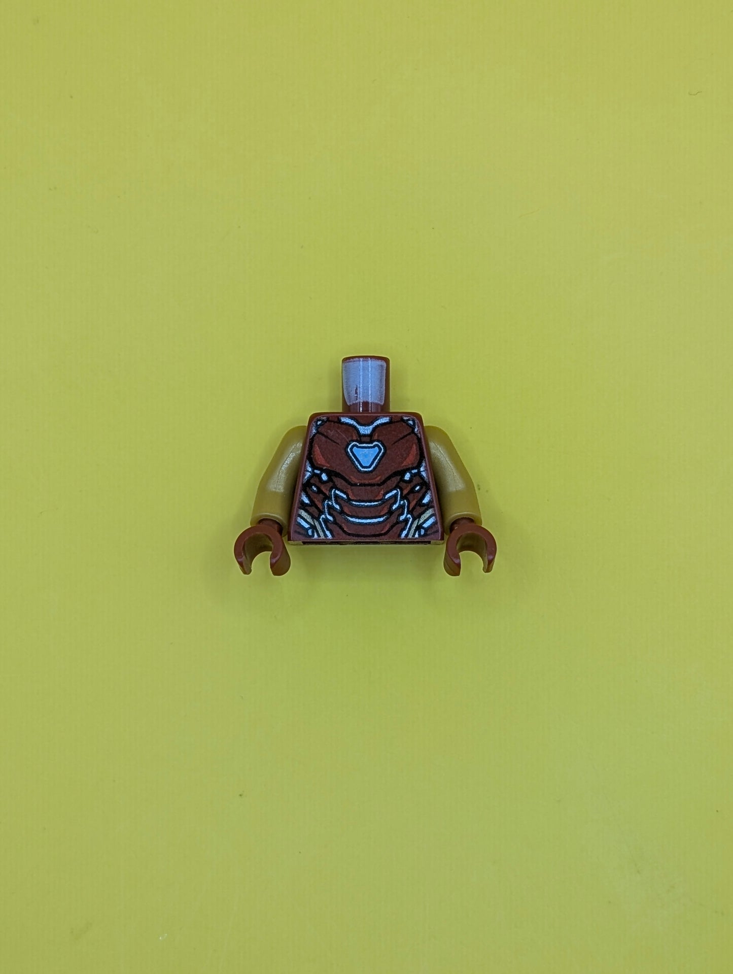 973pb3503c01 Torso Armor with Thin Red Markings, Bright Light Blue Triangular Arc Reactor, Silver and Gold Trim Pattern / Pearl Gold Arms / Dark Red Hands Lego Part