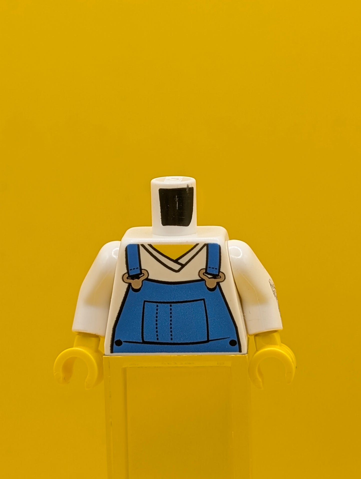 973pb0649c01 Torso V-Neck Shirt with Blue Overalls - Printed Back Pattern / White Arms / Yellow Hands Lego