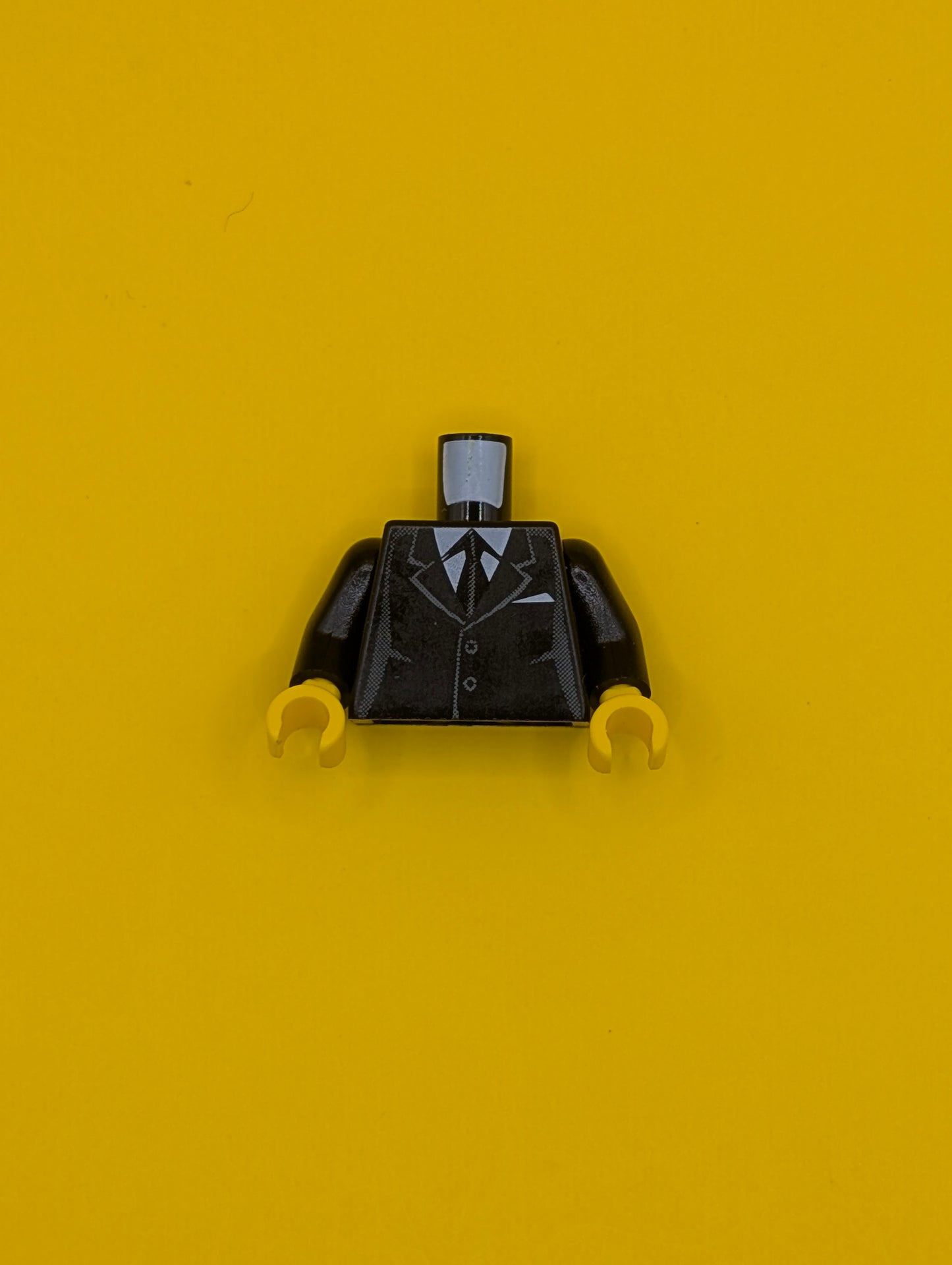 Torso Suit with 2 Buttons, Gray Sides, Gray Centerline and Tie Pattern / Black Arms / Yellow Hands 973pb0322c01 Lego